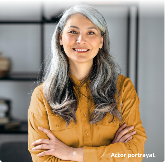 Woman smiling with her arms crossed